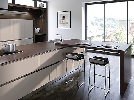 Designküche mit dezent erhöhter Tischplatte im Design der Arbeitsplatte